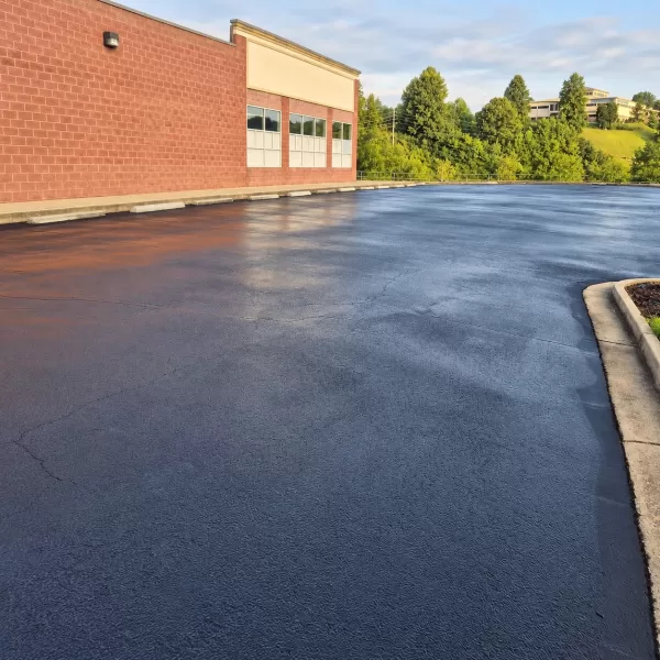 Asphalt sealcoating